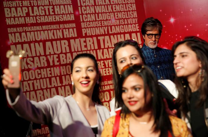 People take pictures of a waxwork of Bollywood actor Amitabh Bachchan at a photocall for the new Madam Tussaud's waxwork museum in New Delhi, India January 12, 2017. REUTERS/Cathal McNaughton