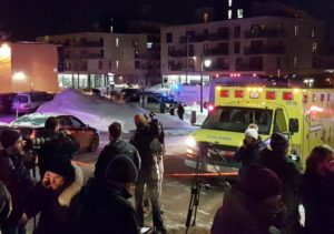 An ambulance is parked at the scene of a fatal shooting at the Quebec Islamic Cultural Centre in Quebec City, Canada January 29, 2017. REUTERS/Mathieu Belanger
