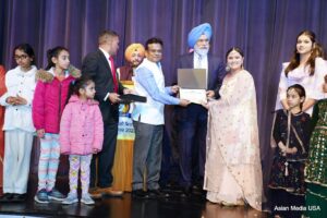 Consul General of India in Chicago Somnath Ghosh, awarding certificates and prizes to children at the Punjabi Language celebration event in Schaumburg, Illinois, March 4, 2023. Photo: courtesy Ginny Jolly