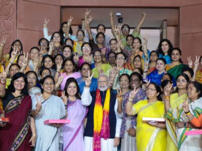 Women MPs expressed their joy for the Women's Reservation Bill passed in the Indian Parliament Sept. 21, 2023. They are seen here with Prime Minister Modi. PHOTO X @narendramodi